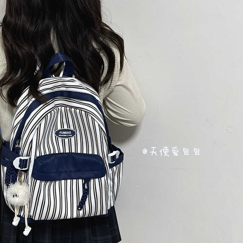 韩国小众设计通勤双肩包时尚条纹撞色小清新防水书包旅行小背包女