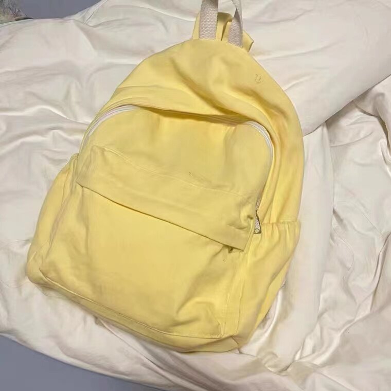自制奶油色双肩包女中学生书包纯色坠感帆布包大学生无印电脑包怎么看?