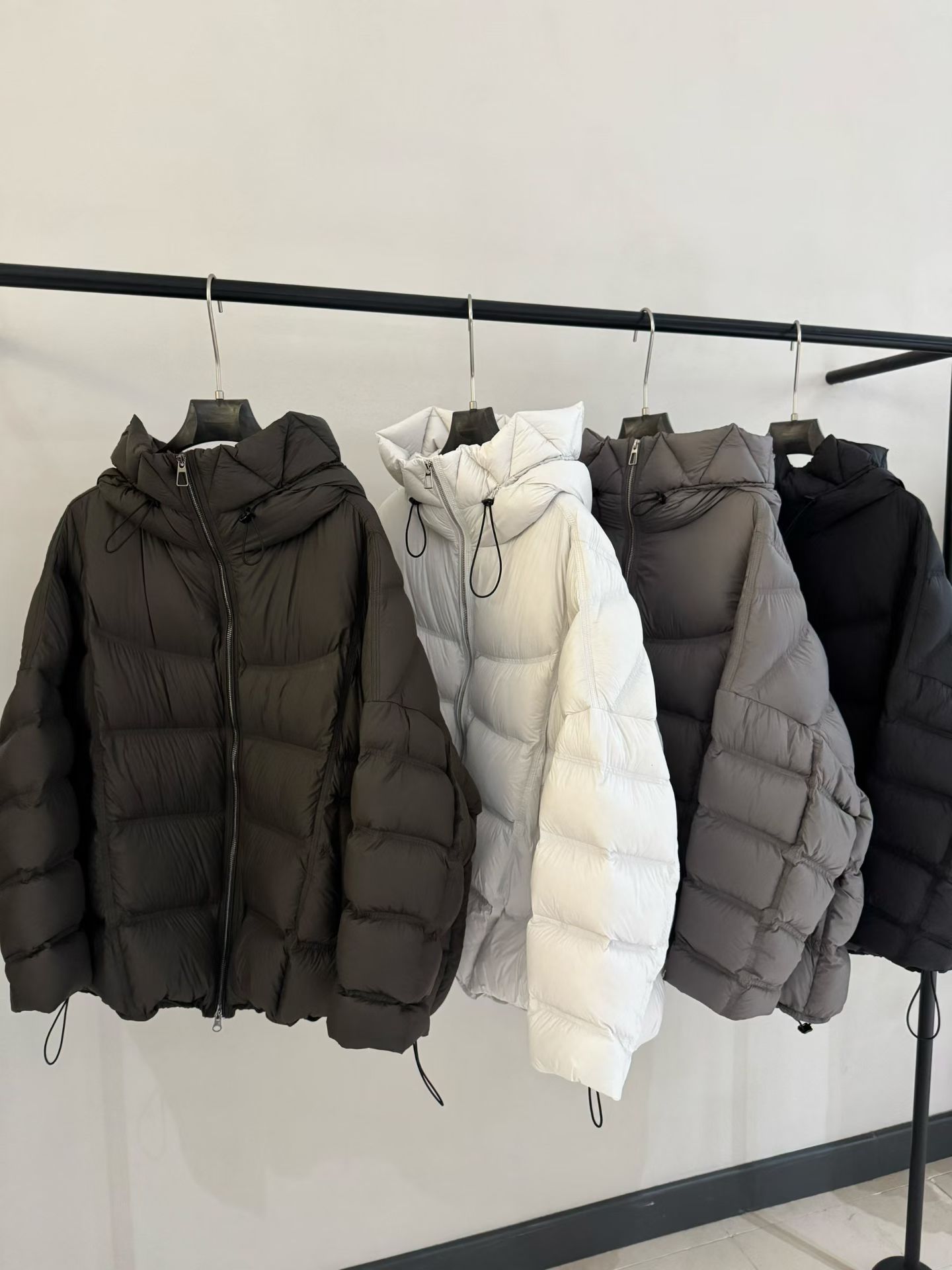 欧洲站2025冬季新款宽松中长款连帽白鸭绒外套休闲抗寒羽绒服女