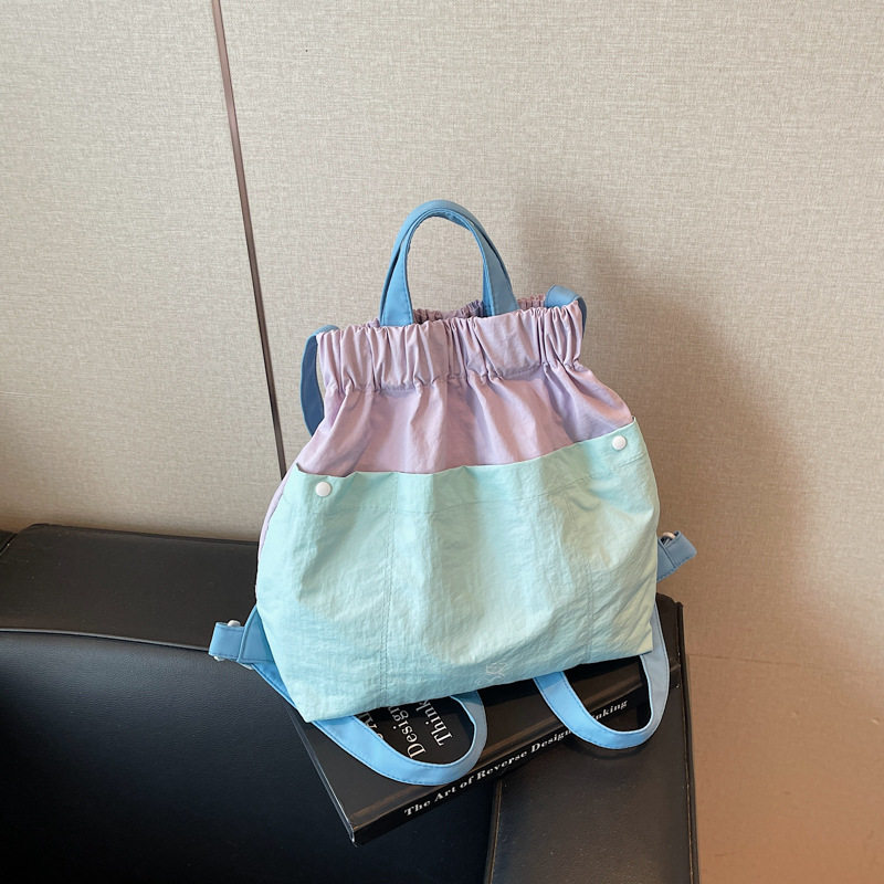 户外轻量化双肩包女旅游轻便多巴胺拼色防水尼龙布背包折叠遛娃包图片