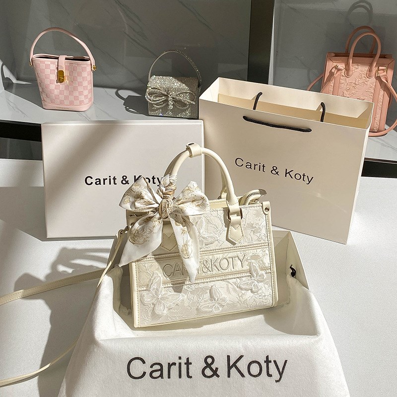 Carit&Koty 小众设计镂空蝴蝶结通勤聚氨W酯合成革手提包
