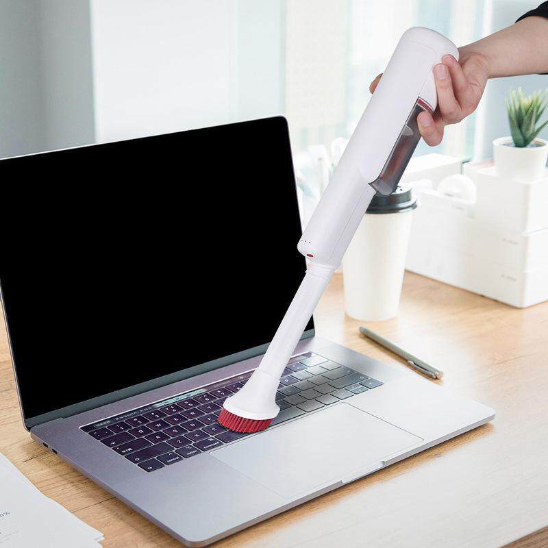 新款式手持宠物吸尘器USB充电家用车用多功能宠物刷跨境