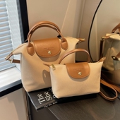 上班通勤包女2026新款 休闲帆布斜挎包上班族小拎包手提饺子包 时尚