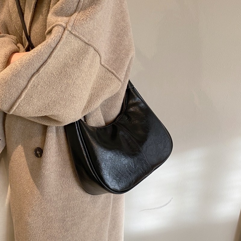 高级感包包女士2026新款潮时尚通勤单肩腋下包复古百搭斜挎饺子包