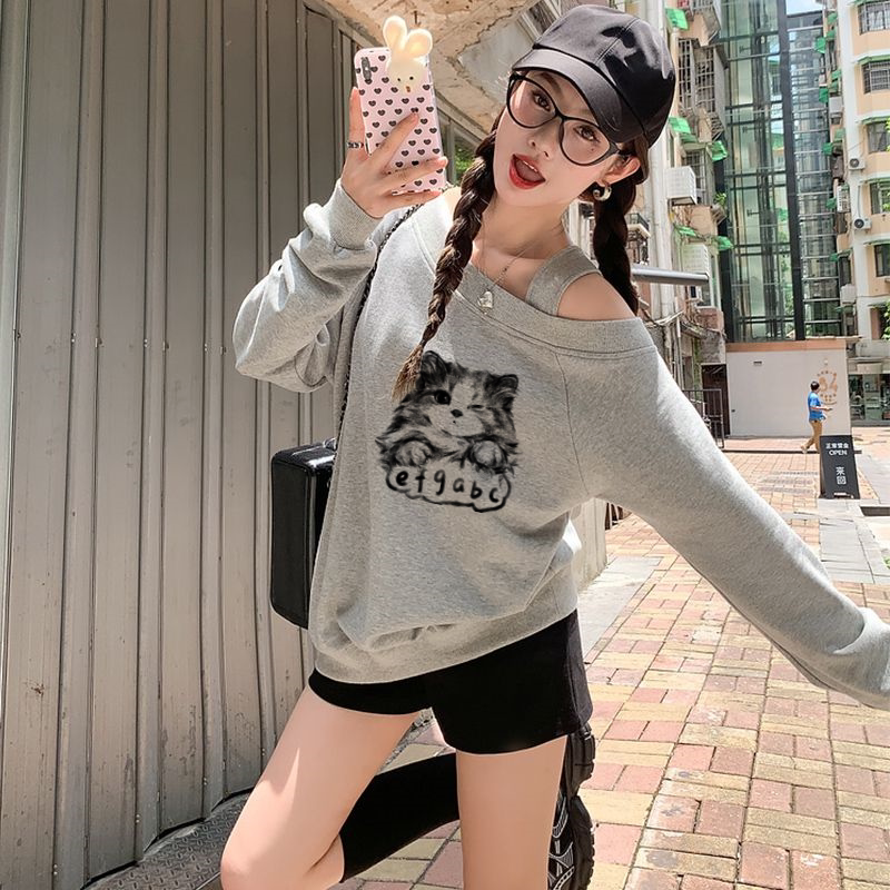宽松慵懒风套头卫衣女新款2026秋季斜领露肩趣味猫咪印花上衣ins