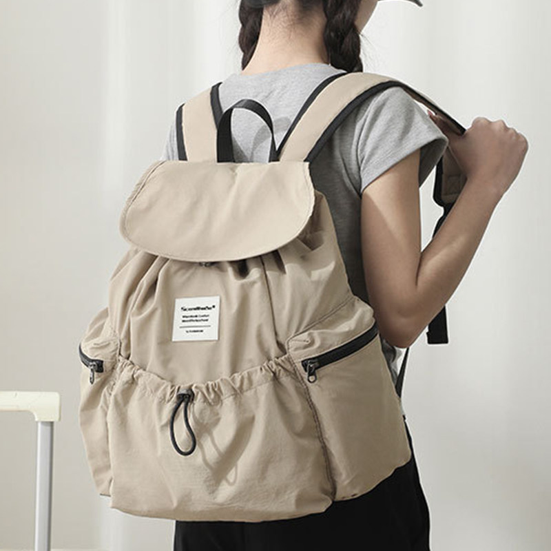 日系休闲双肩背包大容量通勤抽绳翻盖学生书包轻便旅行背包ins风