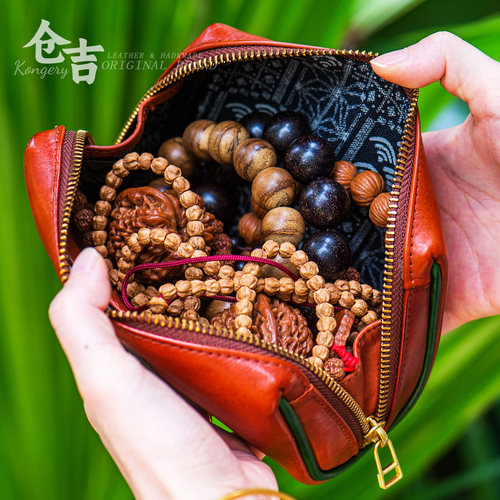仓吉手工头层牛皮手拿包