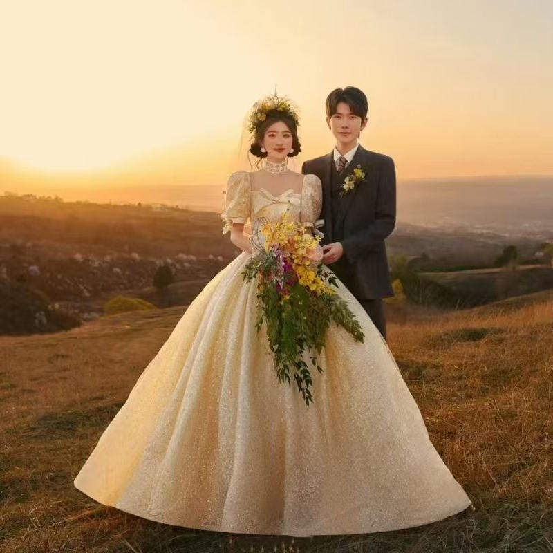 影楼新款婚纱拍摄礼服法式浪漫夕阳落日氛围感外景香槟色亮片拖尾