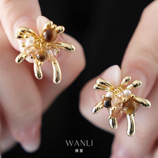 挽里美拉德金色虎眼石烟花耳环耳钉女2026新款 轻奢高级感秋冬 爆款