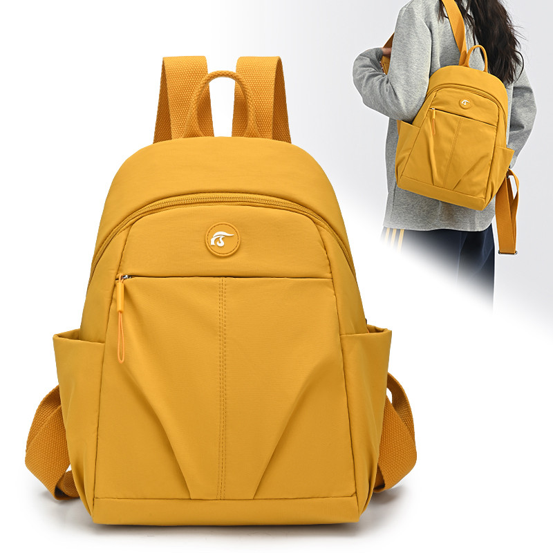 2026春季新款简约风双肩包女大容量防水轻便通勤书包黄色旅行背包