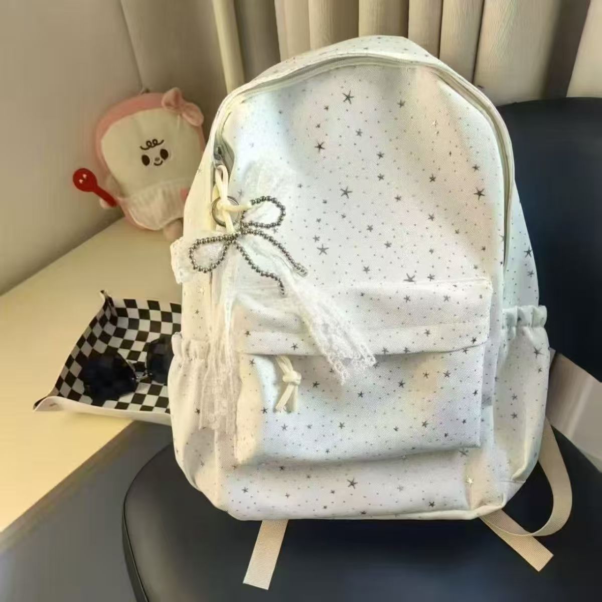 星星印花双肩包女小众设计感书包大容量通勤背包简约森系抽绳背包
