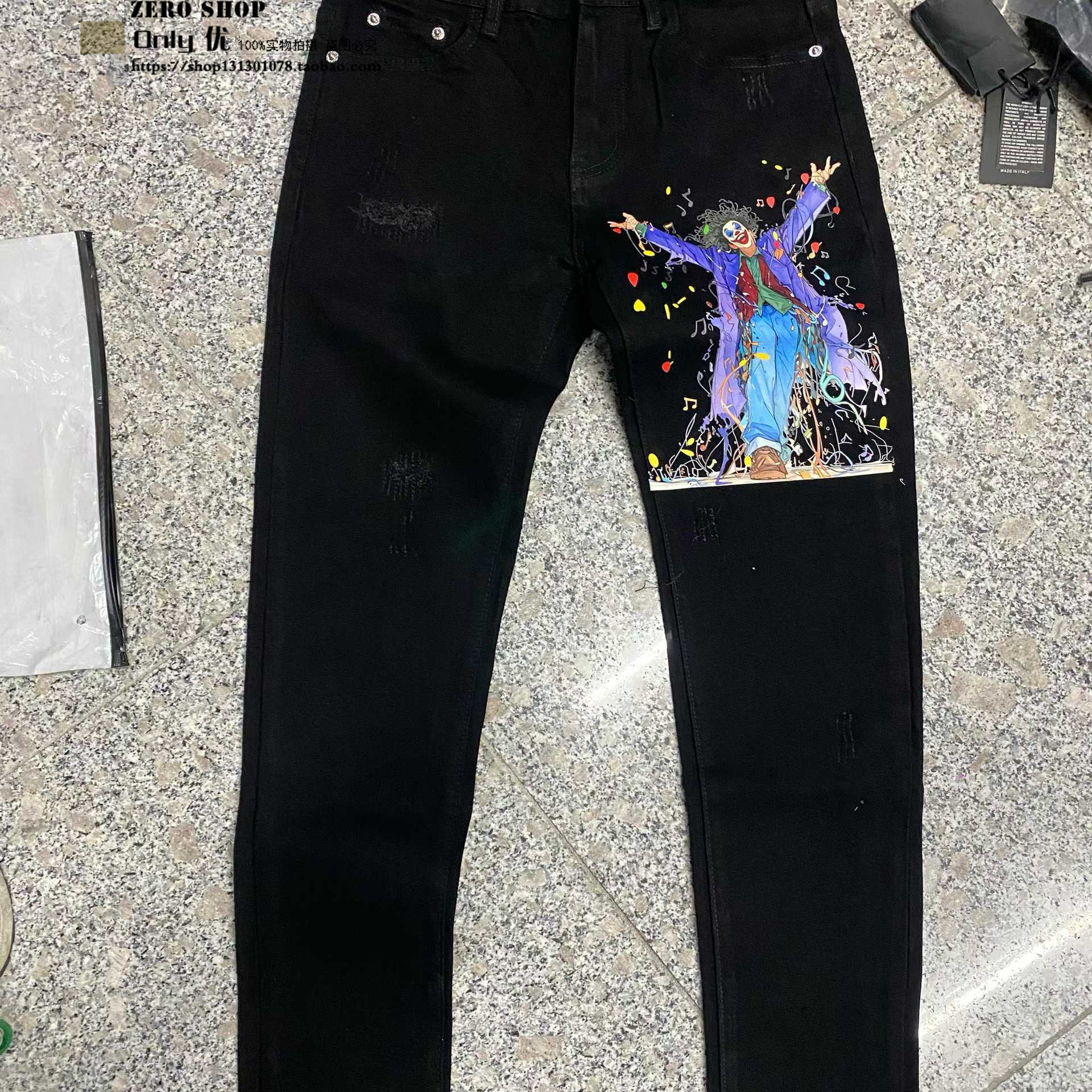 欧货秋季新款黑色破洞小丑印花牛仔裤时尚潮流修身小脚个性涂鸦