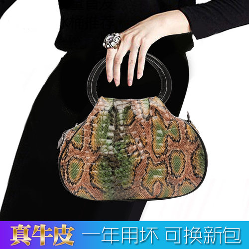 民族风真皮立体压花手拿包宴会包