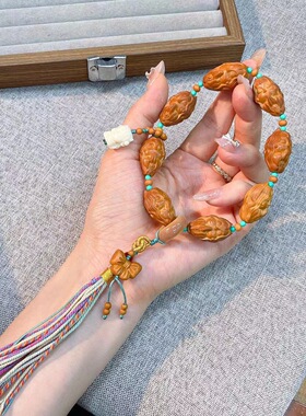 新款橄榄核九尾手链女搭配磷镁矿象牙果菩提根跑环檀香蝴蝶结