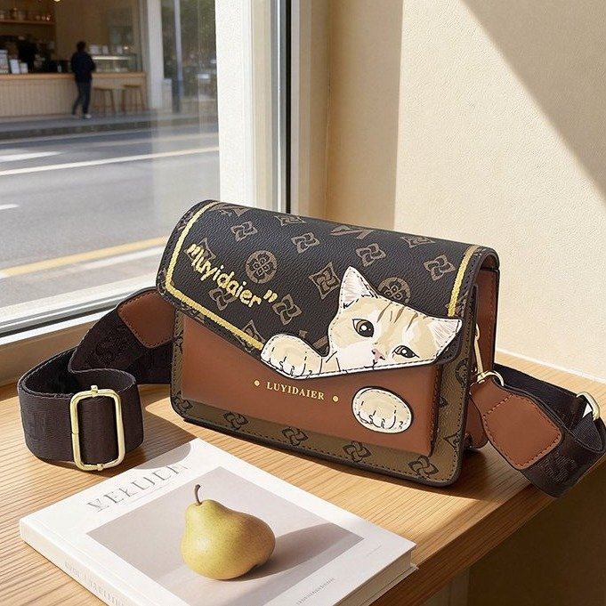 2026春季新款猫咪图案时尚风单肩包百搭休闲印花斜挎包翻盖包潮流
