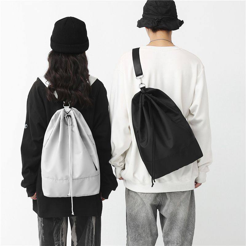 单肩双肩两用包包女纯色休闲帅气男运动骑行侧揹包简约抽绳束口斜