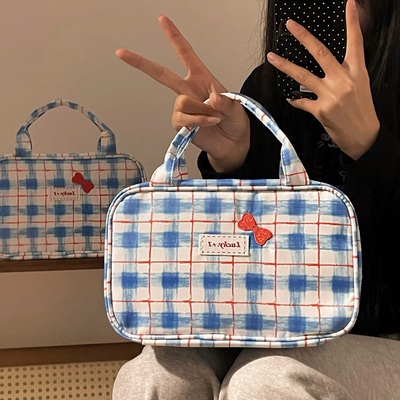 蓝色蝴蝶结化妆包手提分区洗漱包