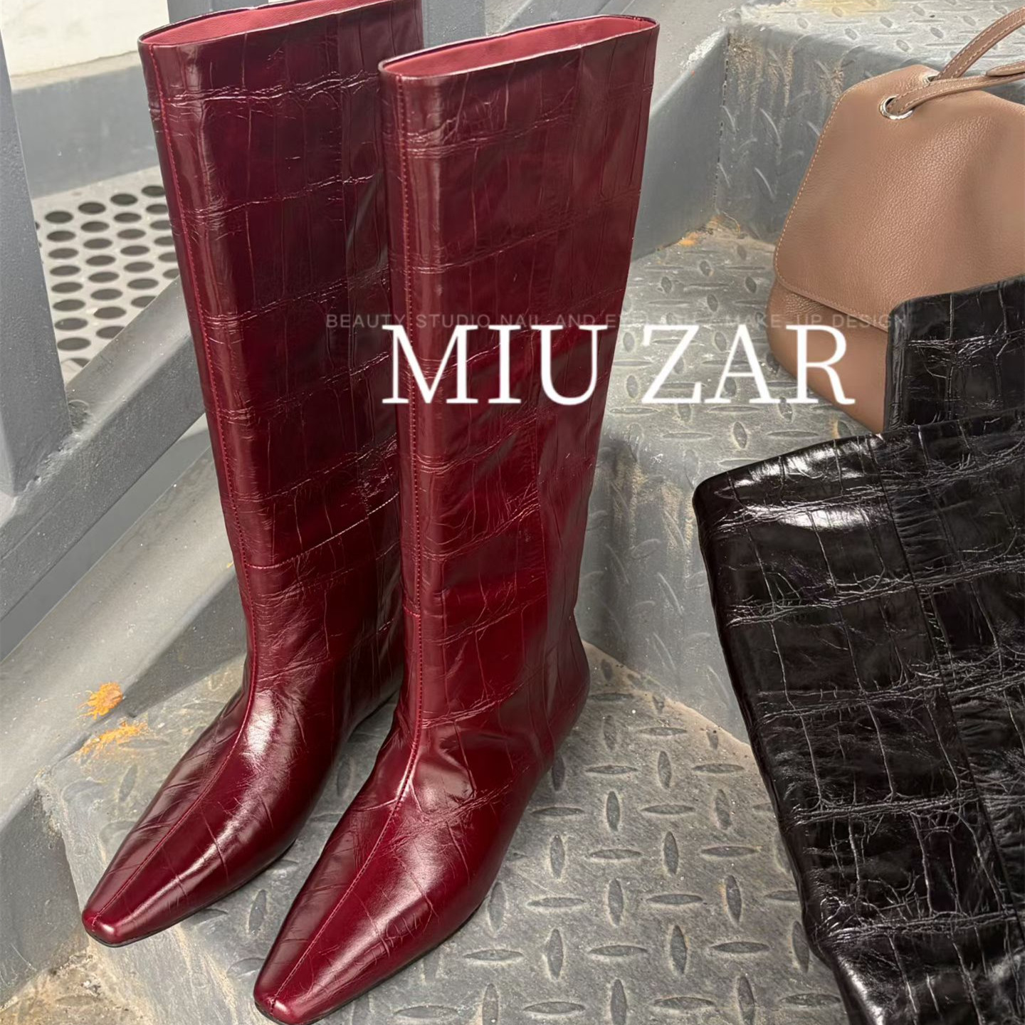妙莎MIUZAR女鞋2026秋季新款真皮骑士靴高筒套筒石头纹牛皮时装靴
