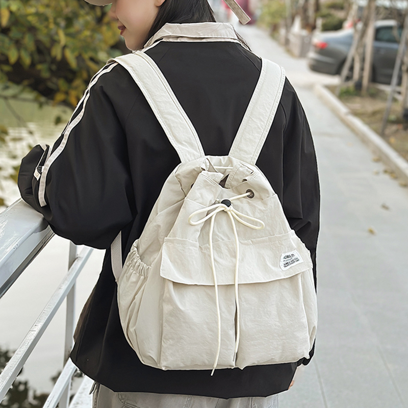 单肩包女大学生手提包通勤包百搭大容量简约多用双肩包男2025新款