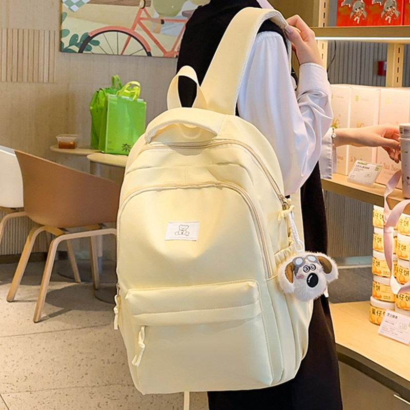 2025新款书包女大学生纯色系学院风背包女式通勤休闲双肩包减负版