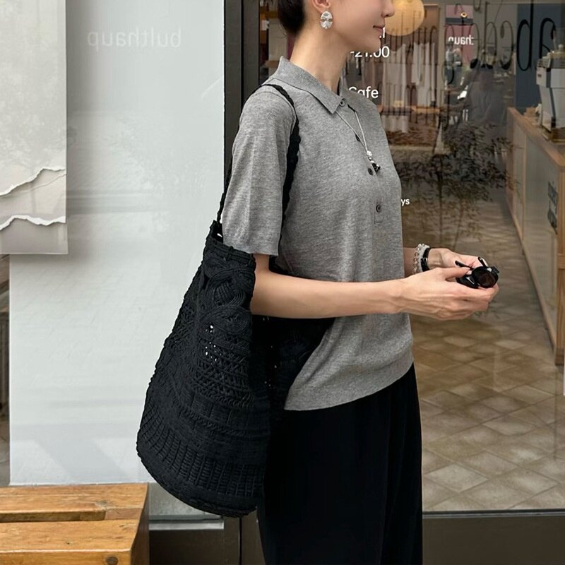 旅行通勤松弛感大容量水桶包2026新款手工编织钩花镂空托特包度假
