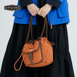 UNICARE运动休闲户外复古旅行包 男女手拎手拎单肩斜挎包2026新品