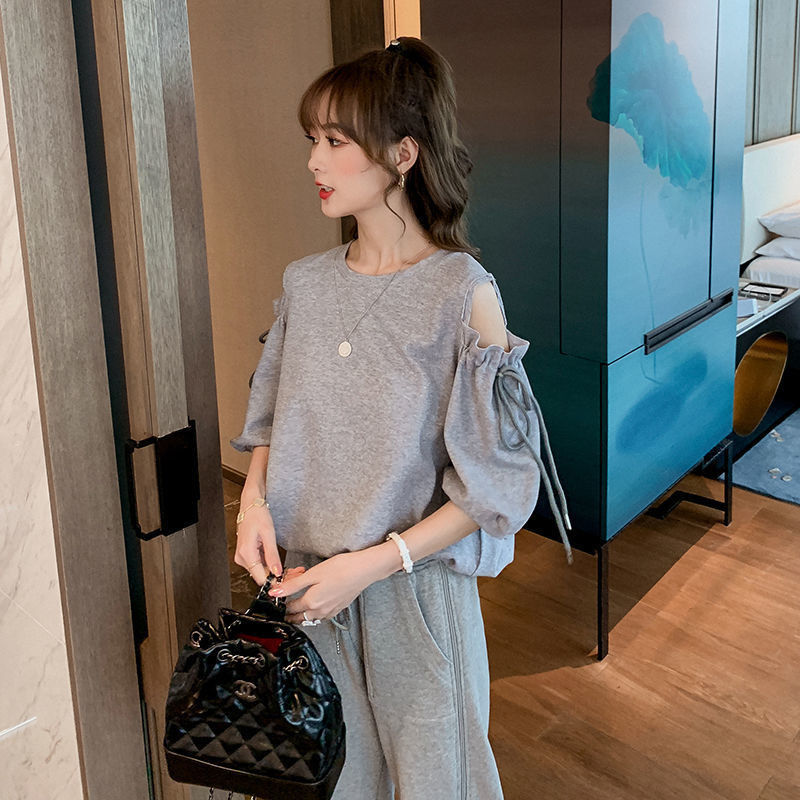 Early spring top women's design half sleeve Korean loose solid off shoulder sweet versatile round neck short sleeve shirt