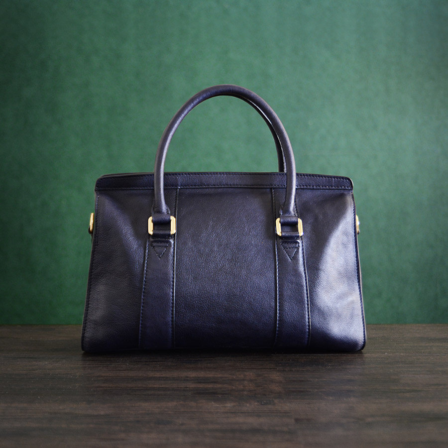 牧石大容量商务牛皮行李包出差旅游包男士手提短途真皮旅行包黑色