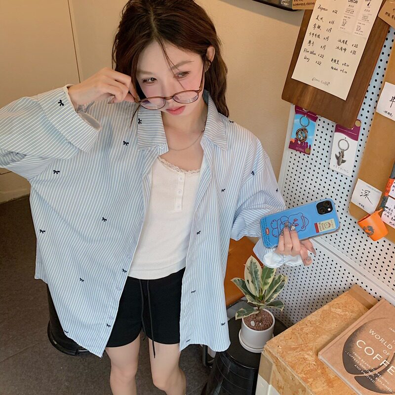 蝴蝶结印花衬衫女2026年秋季新款宽松长袖浅蓝色百搭条纹衬衣上衣
