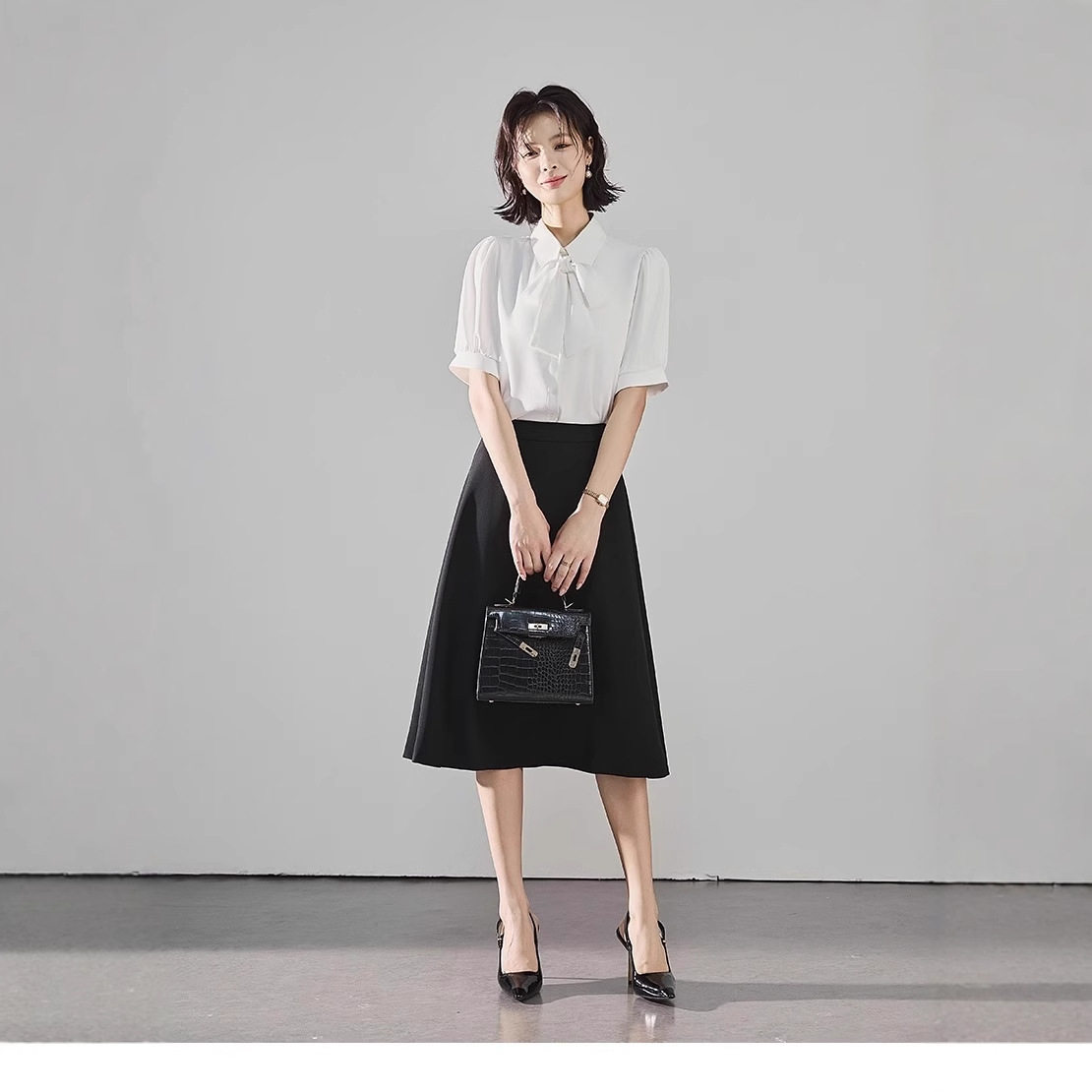 黑色西装半身裙女夏季薄款公考面试A字中长裙通勤气质正装裙子