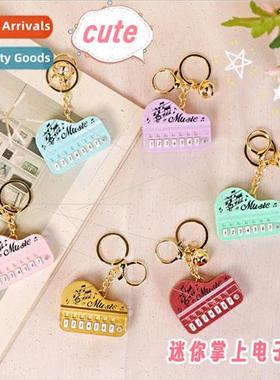 Mini handheld electronic piano game machine cute luminous ke