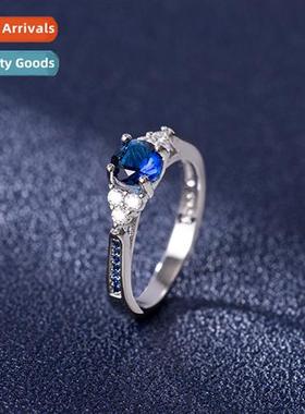 Diamd aquamarine ring female      four claws set wh diamds b