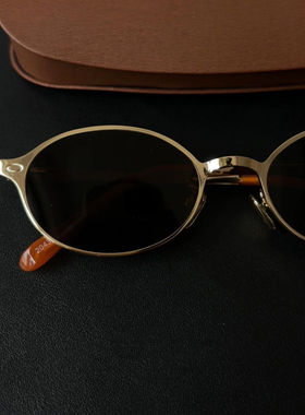 黑茶镜片金丝边椭圆形太阳眼镜