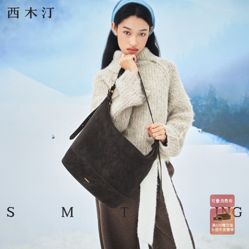 西木汀夜光2025秋冬新款水桶包女大容量通勤包简约单肩包斜挎大包