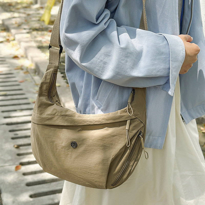 日本品质男女包2025新款斜挎包轻便休闲男女款简约通勤学生上课单