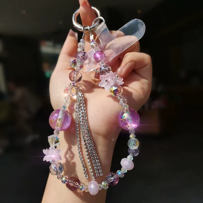 梦幻紫渐变琉璃珠手机挂链仙气花朵镶钻流苏款便携防摔手腕链挂件