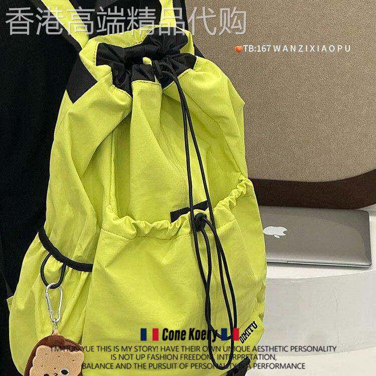 法国户外徒步登山包轻量化运动风双肩包男女同款羽毛球滑板包背包