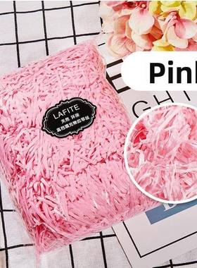 gift lined with shredded paper filling, colored packing box