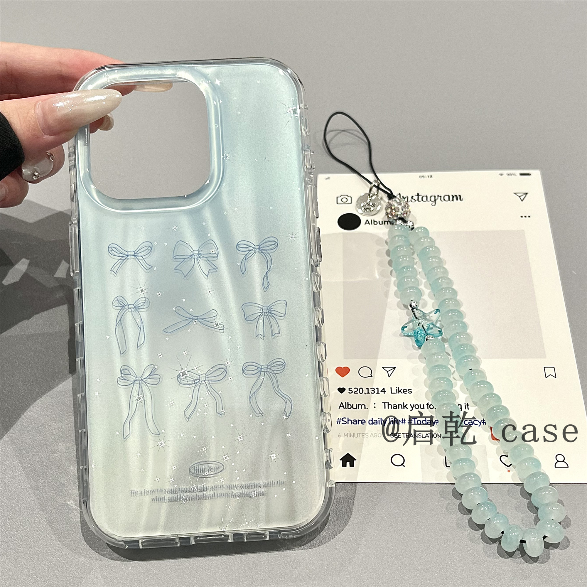 启乾 蓝色渐变蝴蝶结腕带iPhone16/15手机壳适用苹果14/13promax双层硬壳链条挂绳高级感镭射小众日韩ins新款