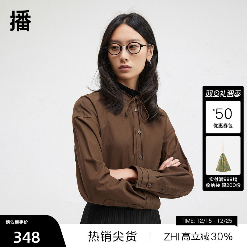 时髦串绳立领，袖口三层压褶设计