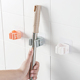 粘胶免打孔挂拖把夹卫生间滚轮居家挂钩浴室粘钩扫免钉卡座拖套装