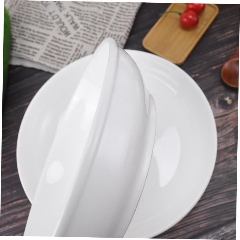 Plain white ceramic salad bowl deep soup plate chopped peppe