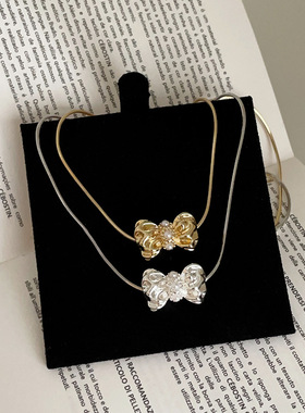 设计感蝴蝶结珍珠吊坠项链女简约时尚潮流精致通勤百搭颈链锁骨链