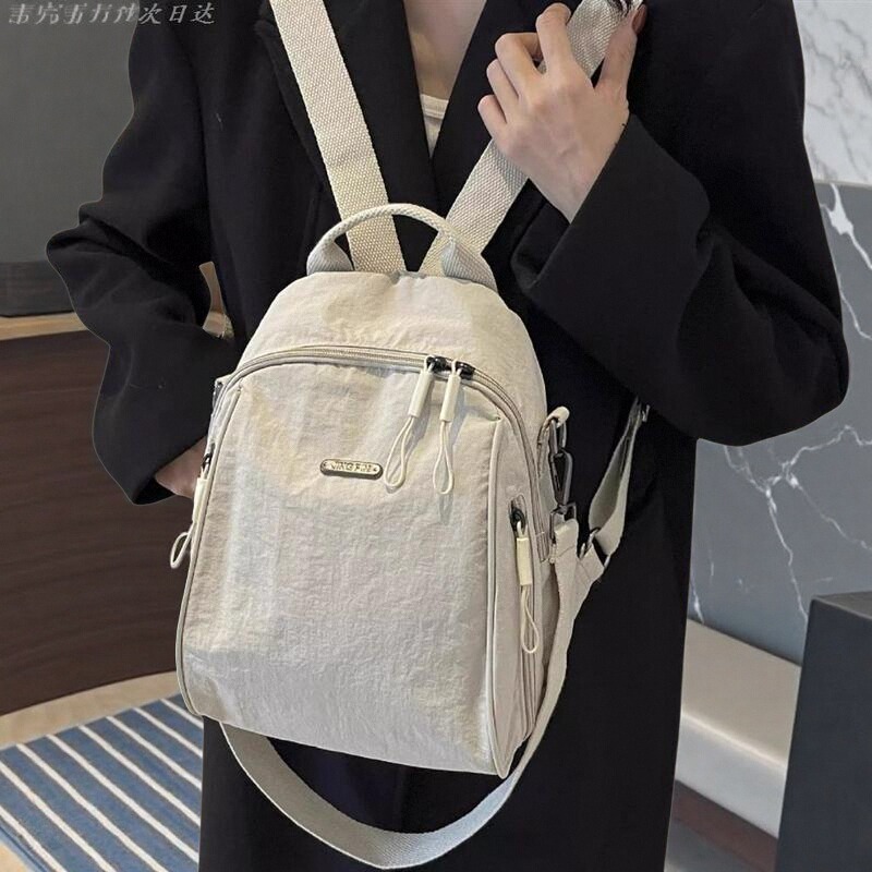 手提新款大容量通勤旅行双肩包