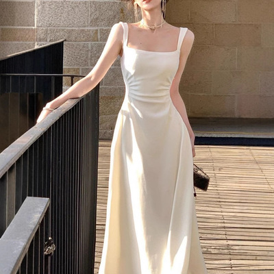 白色吊带连衣裙女2025夏季新款收腰显瘦设计感小众法式长裙