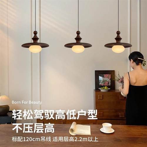 A walnut-colored pagoda chandelier on the bed of the medieva