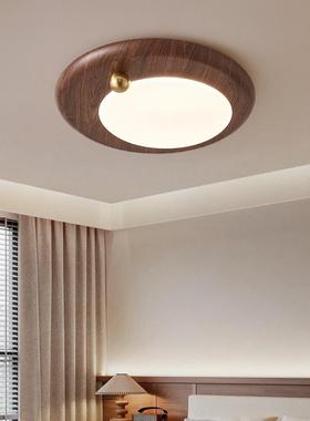 The middle-winded bedroom is refilled with a walnut-coloured