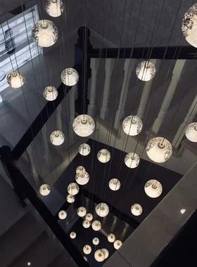 The chandelier on the staircase in the Nordic villa lightly