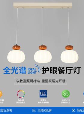 The chandelier in the restaurant is a red and creative pumpk