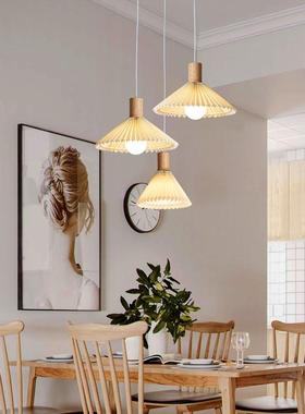 The chandeliers at the logwind restaurant are modern, simple